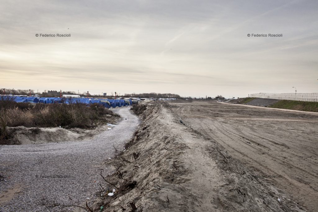 Calais, France. February 28, 2016. View from the wall between the cleared area and the camp. In the last week a part of the camp was destroyed by the French government and the area completely cleared. The Calais Jungle Camp for migrants, in Calais, France, dates January 2015, it is now the biggest refugee camp in Europe, hosting around 3700 migrants from all over the world. The people hosted in the camp are willing to reach the UK due to the lack of job opportunities in the rest of Europe.