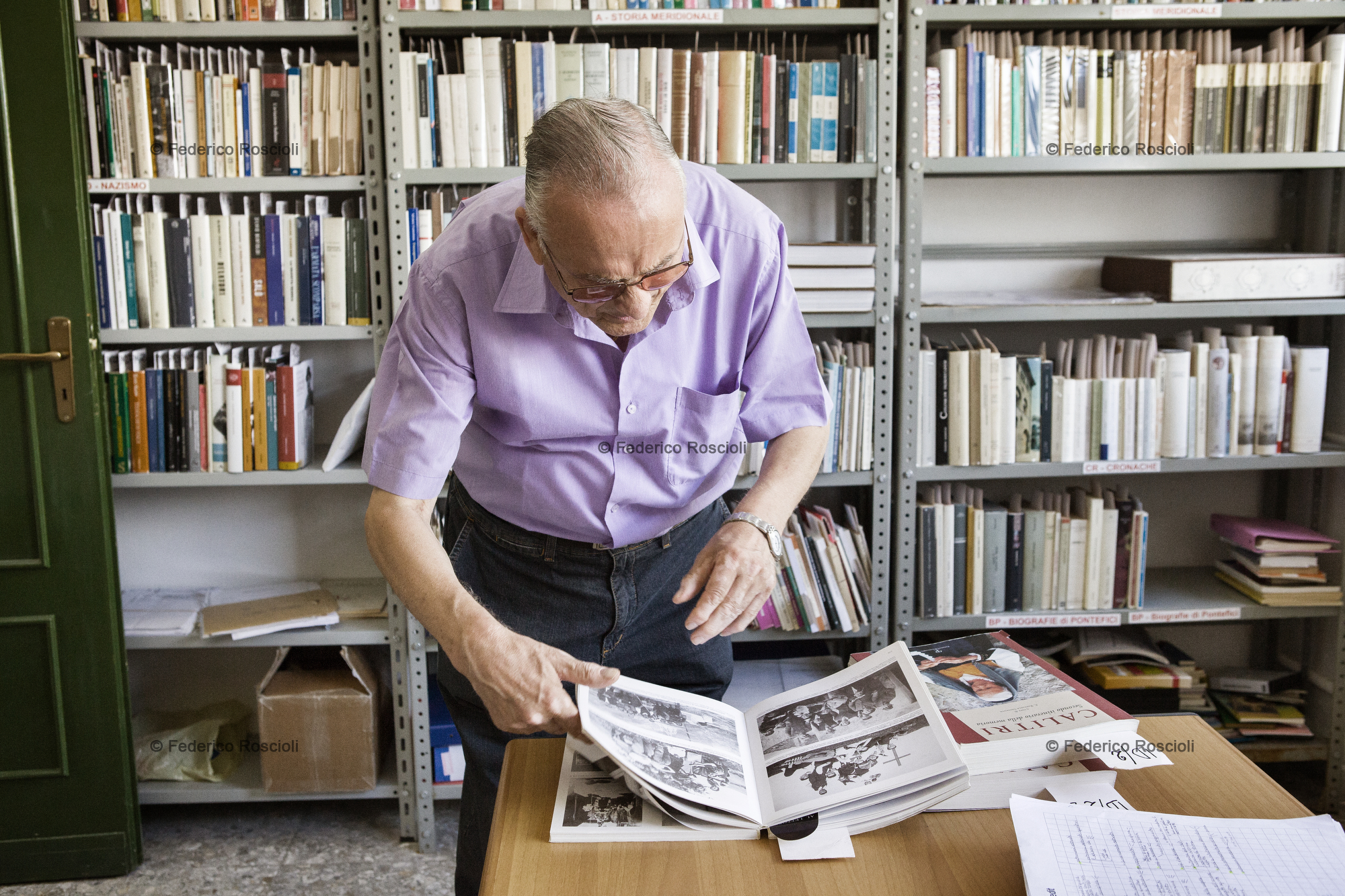 Calitri, Avellino, Italy. August 28, 2013. Raffaele Salvante, creator and director of Il Calitrano, inside Centro Studi Calitrani, a public library that shares more than 8000 titles once belonged to him.