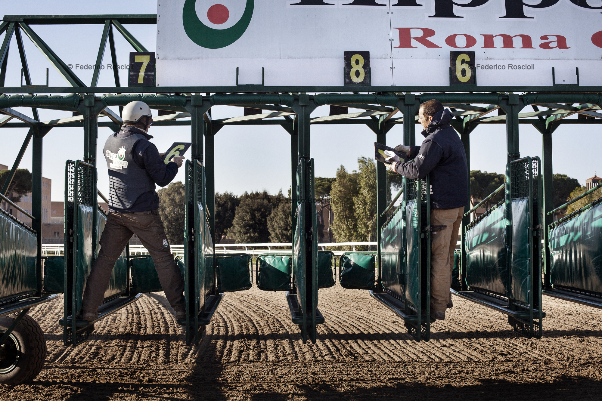 Rome, Italy. January 25, 2014. Racing commissioners preparing the fences in Capannelle.