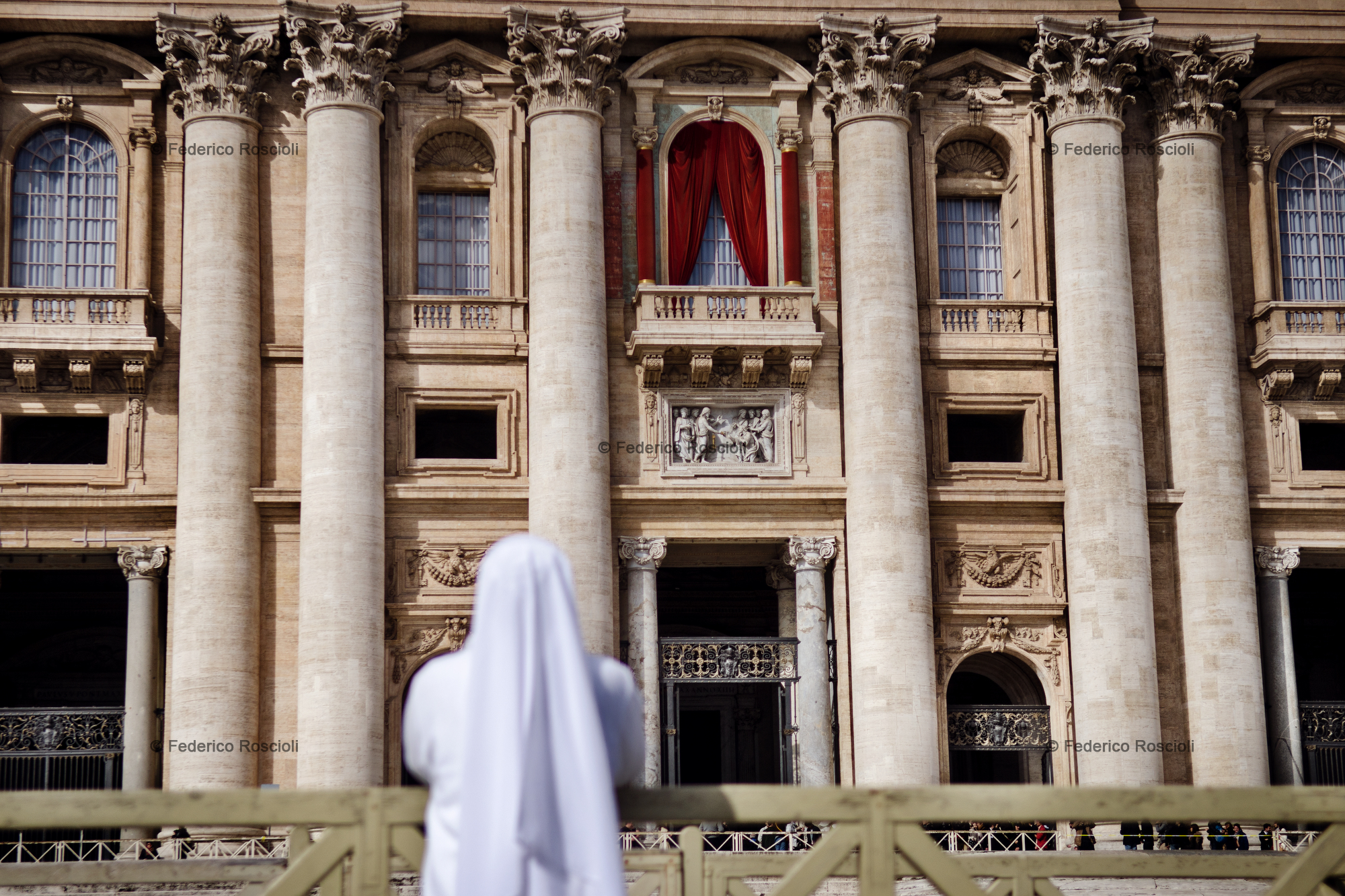 Vatican, Vatican City, March 12, 2013. A nun praying in front of Saint Peter during the first day of Conclave.