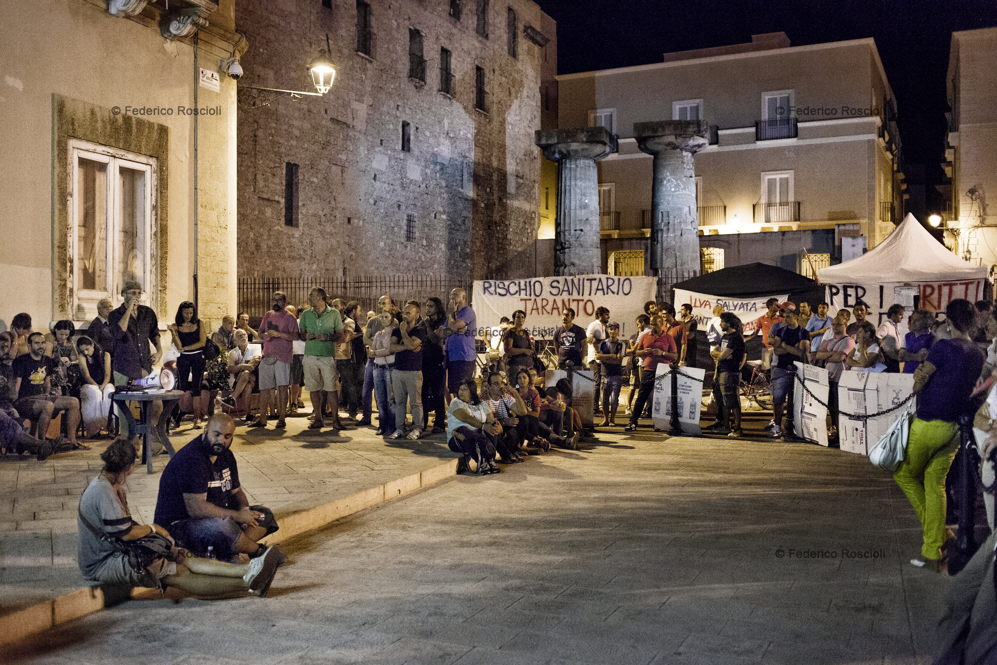 Taranto, Italy, September 11, 2013. A meeting during the third day of protests in front of the municipality of Taranto. This sit-in lasted 26 days and was organized by associations and citizens of Taranto united under the name of 'Cittadini #fuoridalcomune' (Citizens outside of the municipality building): they asked more attention and participation by the local institution on environmental issues.